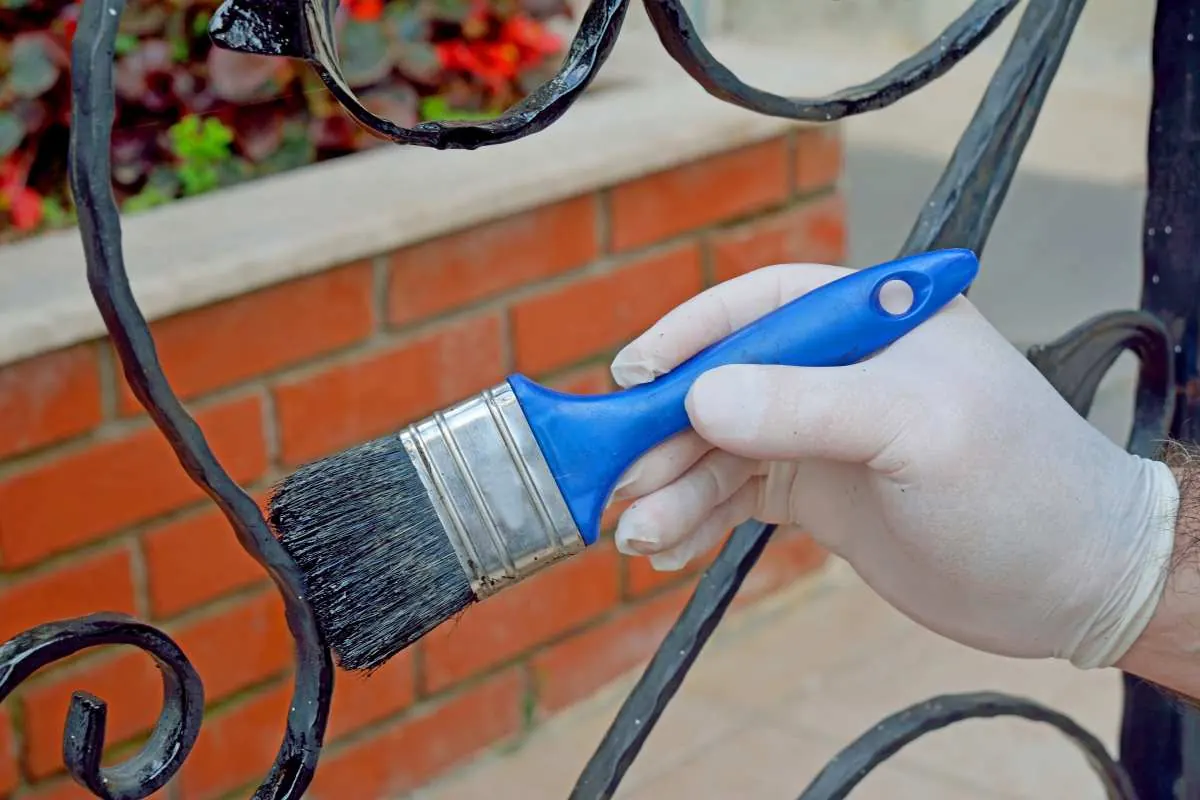 Sanding rust off a metal surface before painting